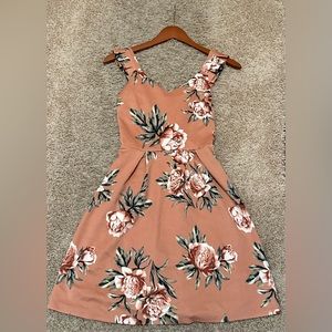 This Monteau dress is a size small and is pink/orange with flowers